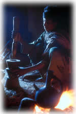 woman using pestle and mortar
